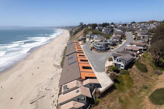 drone / aerial view with a view of the beach and a water view