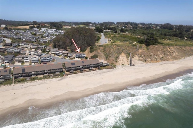 bird's eye view with a water view and a view of the beach