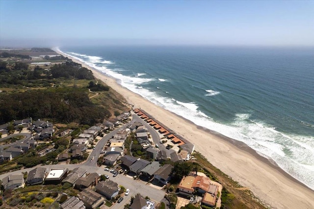 aerial view featuring a water view and a beach view