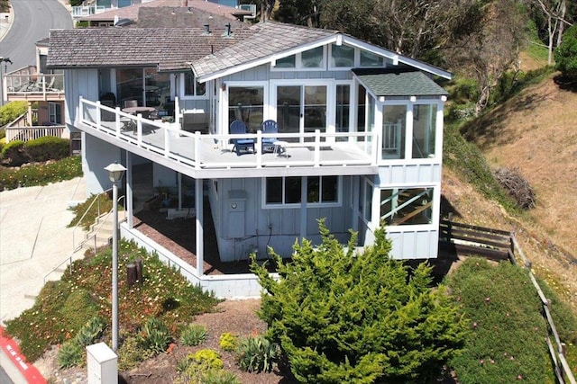 back of property featuring a sunroom