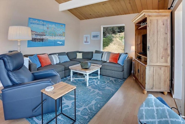 living room with lofted ceiling with beams, light hardwood / wood-style floors, and wooden ceiling