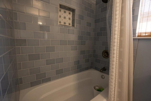 bathroom featuring shower / bathtub combination with curtain