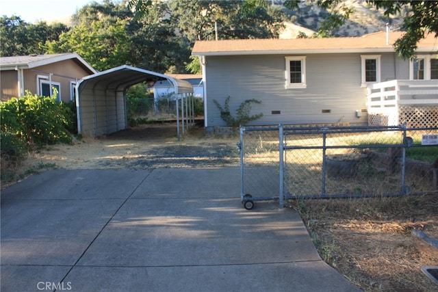 exterior space featuring a carport