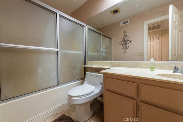 full bathroom with vanity, tile patterned floors, enclosed tub / shower combo, and toilet