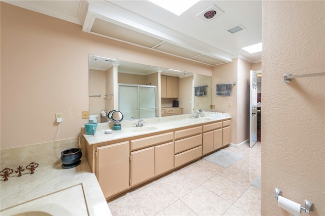 bathroom with walk in shower, ornamental molding, tile patterned flooring, and vanity