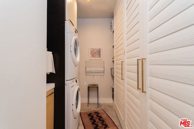 laundry room featuring stacked washing maching and dryer