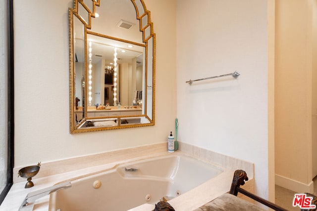 bathroom featuring a relaxing tiled tub