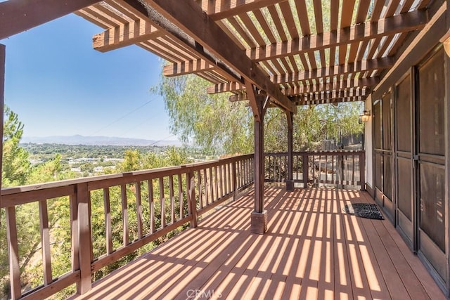 wooden terrace with a pergola