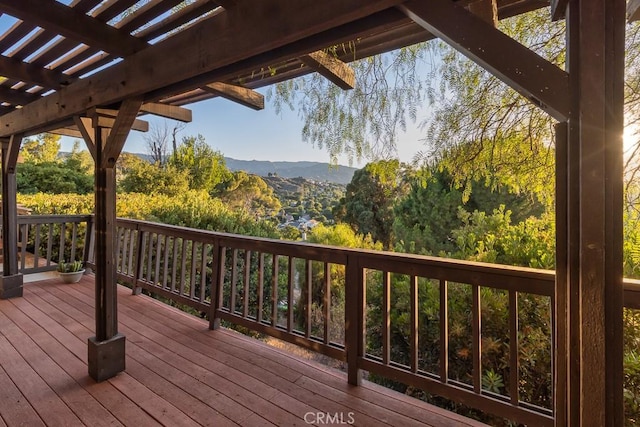 wooden deck featuring a mountain view