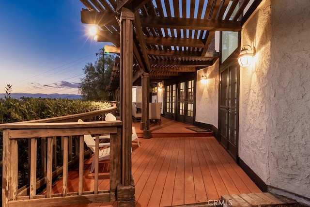 deck at dusk with a pergola