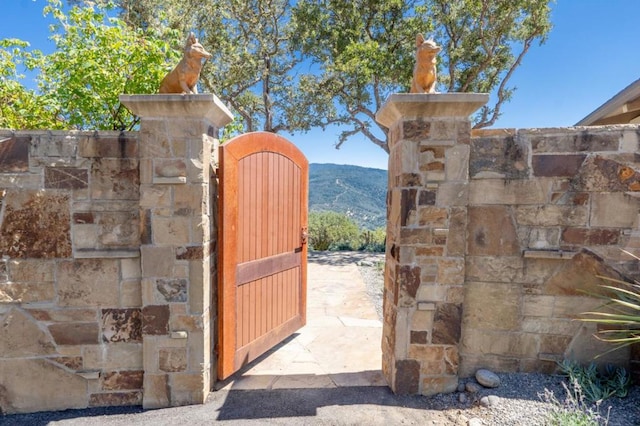 view of gate with a mountain view