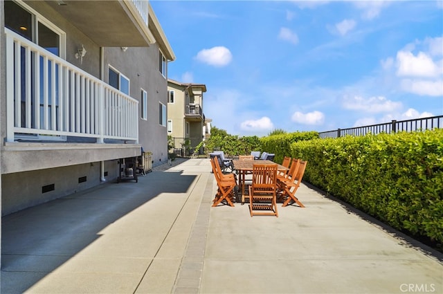 view of patio featuring a balcony