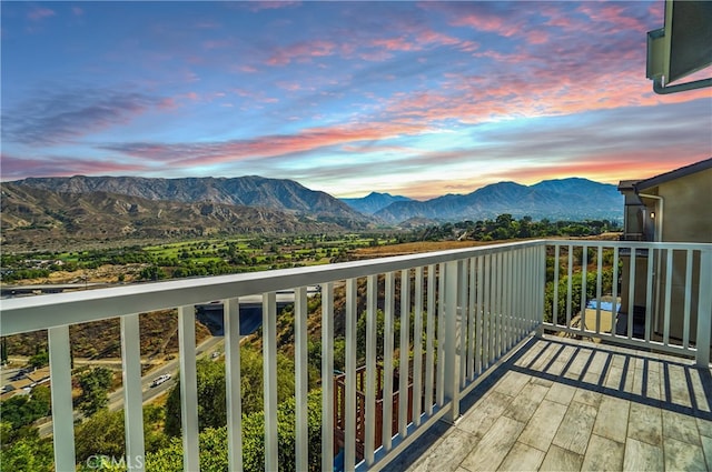 balcony at dusk with a mountain view