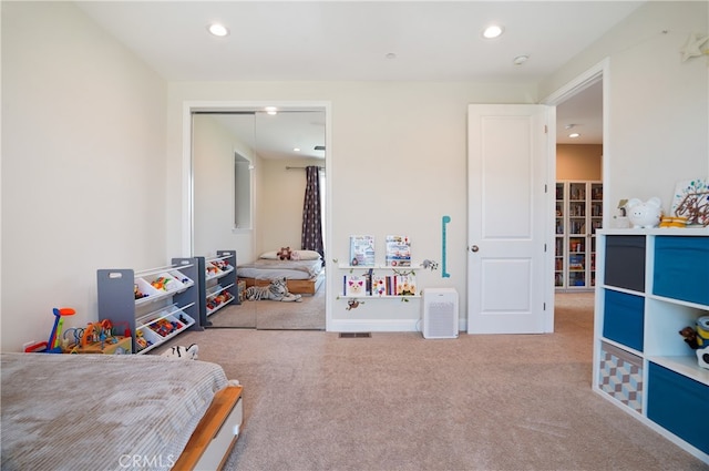 carpeted bedroom with a closet