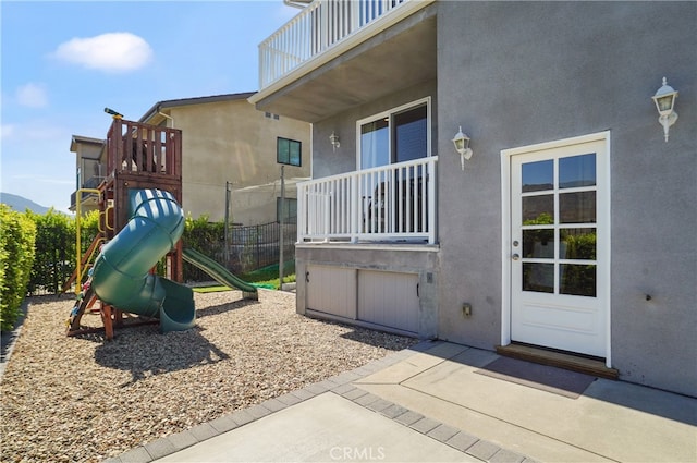 view of jungle gym with a patio