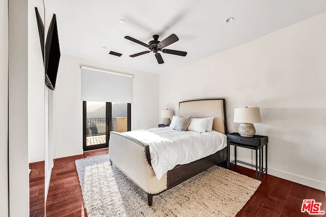 bedroom with dark hardwood / wood-style flooring, ceiling fan, and access to exterior