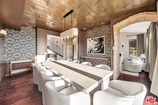 dining space with dark wood-type flooring