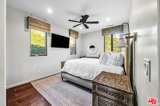 bedroom featuring dark hardwood / wood-style floors and ceiling fan