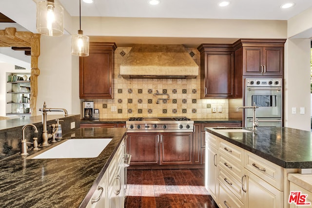 kitchen with custom exhaust hood, stainless steel appliances, sink, and dark hardwood / wood-style flooring