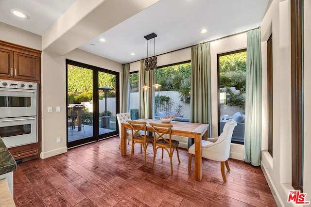 dining room with french doors and dark hardwood / wood-style flooring