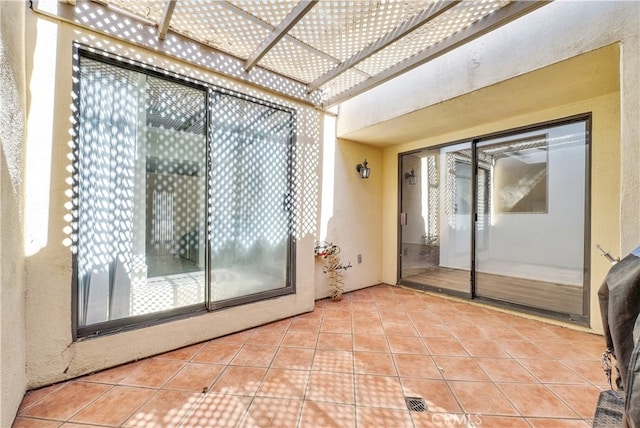 interior space with light tile patterned floors and a wealth of natural light