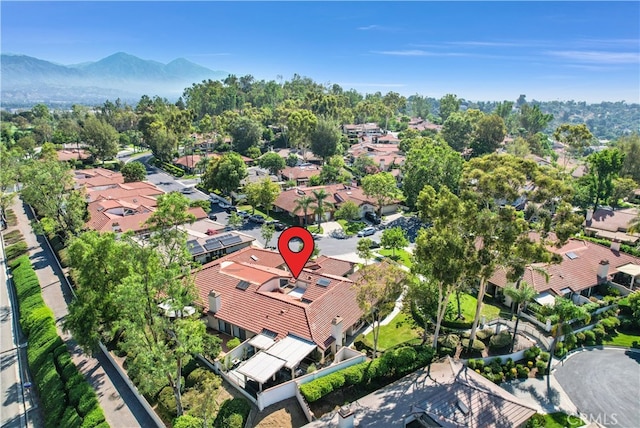 birds eye view of property with a mountain view