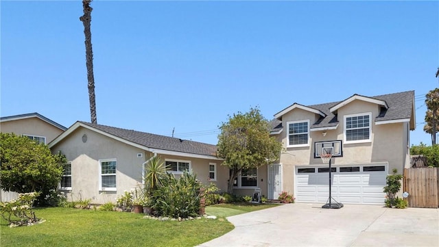 view of front of property with a front yard and a garage