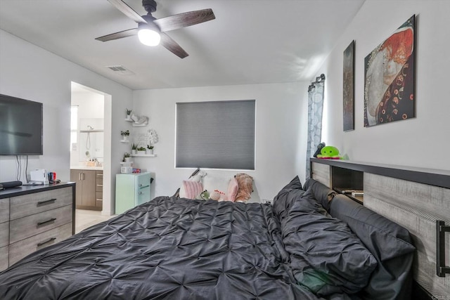 bedroom featuring ceiling fan and connected bathroom