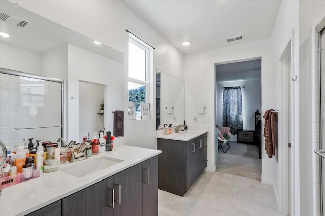 bathroom with vanity, tile patterned floors, and walk in shower