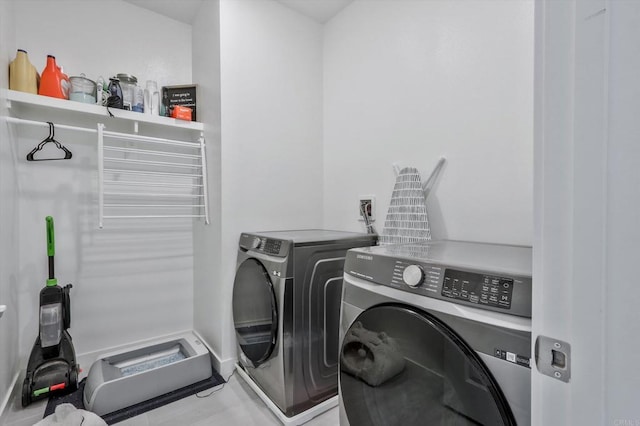 laundry room with washer and dryer