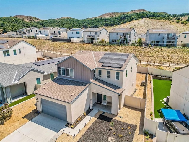 birds eye view of property with a mountain view