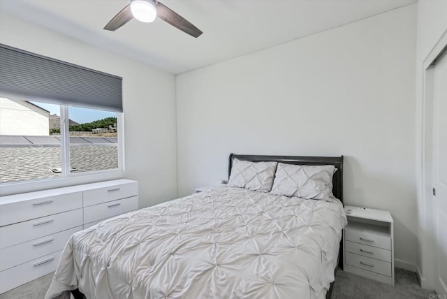 bedroom featuring carpet flooring, ceiling fan, and a closet