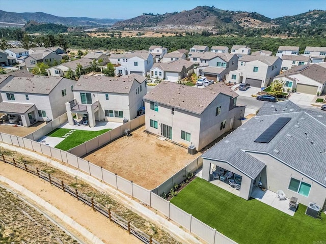 birds eye view of property with a mountain view