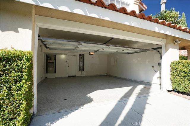 garage with a garage door opener and water heater