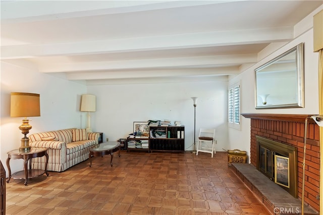 living room featuring parquet floors, beamed ceiling, and a fireplace