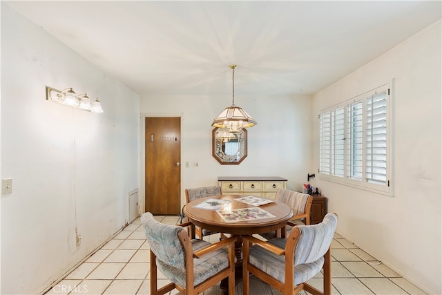 dining area featuring light tile patterned floors