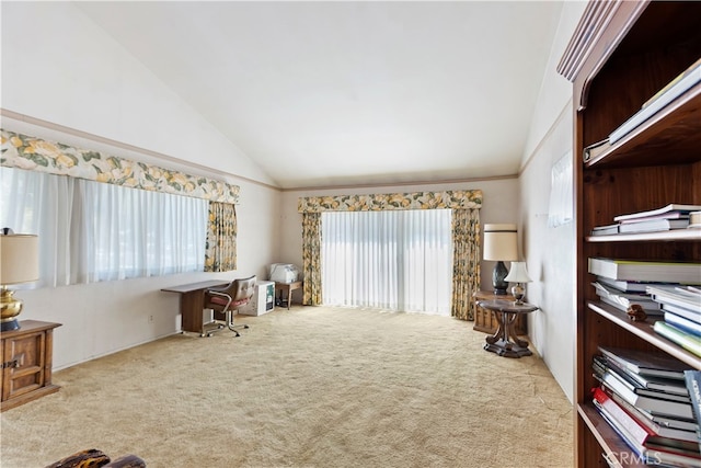 living area with lofted ceiling and carpet flooring