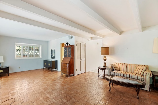 sitting room with beam ceiling