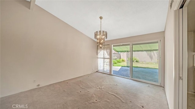 unfurnished room featuring light colored carpet, an inviting chandelier, and lofted ceiling