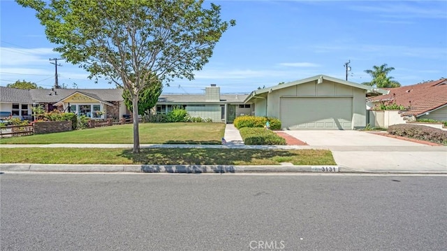 ranch-style home with a front yard and a garage