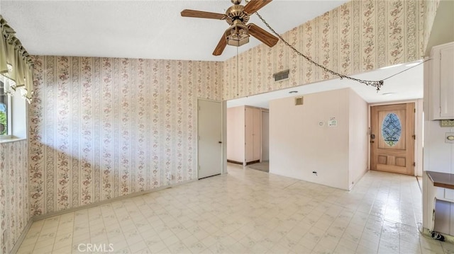 unfurnished room featuring ceiling fan