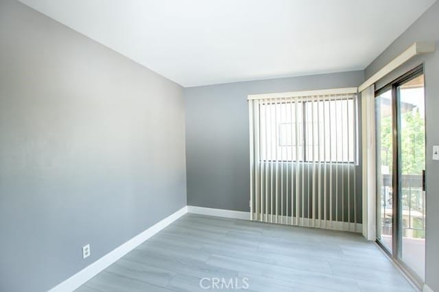 unfurnished room featuring light hardwood / wood-style flooring