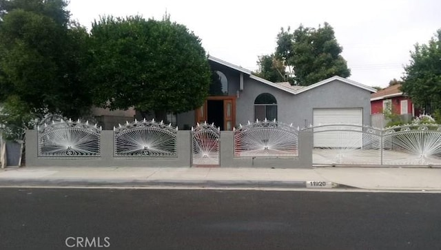 view of gate featuring a garage