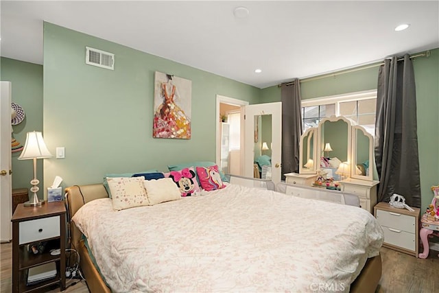 bedroom featuring wood-type flooring