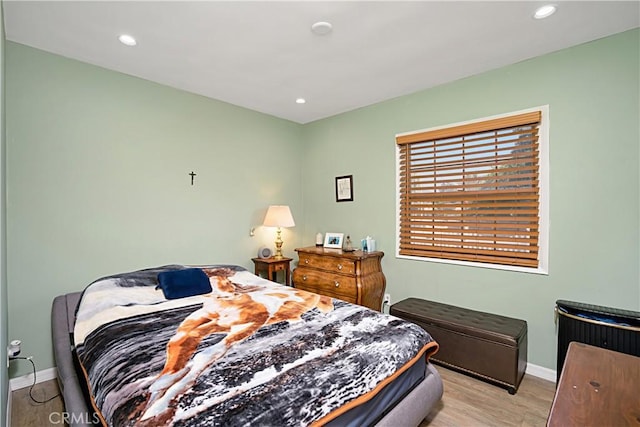 bedroom with light hardwood / wood-style floors