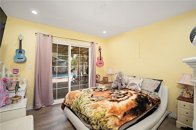 bedroom with dark wood-type flooring