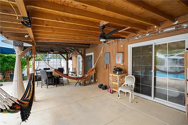 view of patio / terrace with electric panel and ceiling fan