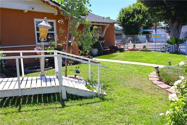 view of yard featuring a deck