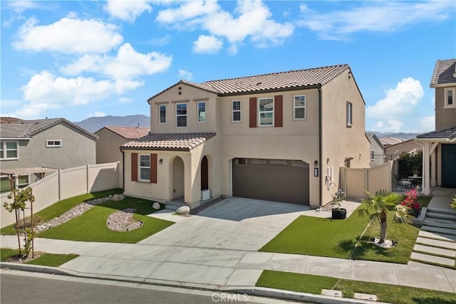 mediterranean / spanish-style house with a garage and a front yard