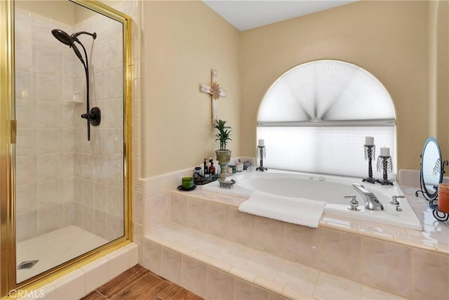 bathroom with shower with separate bathtub